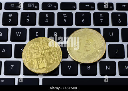 Bitcoin coins on laptop keyboard. Cryptocurrency. Selective focus - image Stock Photo