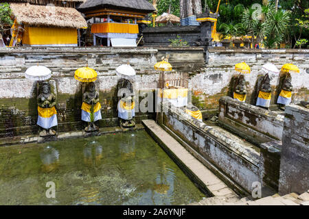 Holy spring water at Goa Gajah temple or also known as Elephant cave in Sukawati district Bali, Indonesia Stock Photo