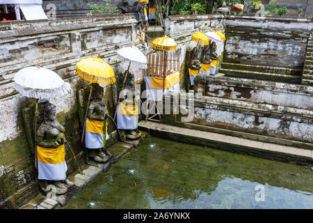 Holy spring water at Goa Gajah temple or also known as Elephant cave in Sukawati district Bali, Indonesia Stock Photo