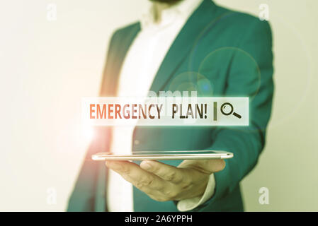Conceptual hand writing showing Emergency Plan. Concept meaning actions developed to mitigate damage of potential events Man in blue suite and white s Stock Photo
