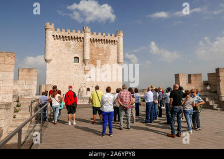 Spain; Castilla-y-Leon: Penafiel: Group of tourists during a guided tour of the castle, medieval fortress situated on a rock spur overhanging the city Stock Photo