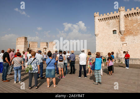 Spain; Castilla-y-Leon: Penafiel: Group of tourists during a guided tour of the castle, medieval fortress situated on a rock spur overhanging the city Stock Photo