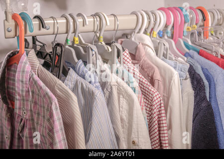 Hangers with Baby Clothes on Rack Stock Photo - Image of garments, inside:  132793586