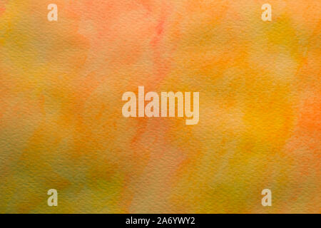 Bright orange background. Creative template with mixing gradient. Paper canvas with yellow ink. Watercolor texture, aquarelle pattern. Stock Photo