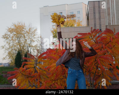 Red Haired Girl Holding Autumn Leaf Stock Photo Alamy