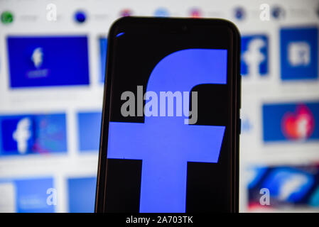 In this photo illustration a Facebook logo displayed on a smartphone. Stock Photo