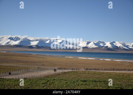 View of Namtso lake with snow capped mountains, Tibet. Namtso is the largest lake in the Tibet Autonomous Region Stock Photo