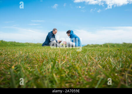 Father and son flying drone Stock Photo - Alamy