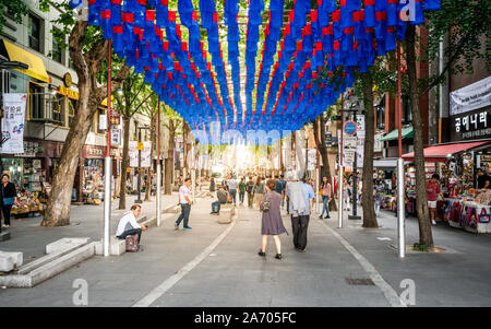 Seoul Korea , 25 September 2019 : Streetview of Insadong pedestrian street with people and dramatic sunset light in Insa-dong Seoul South Korea Stock Photo