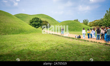 Gyeongju Korea , 29 September 2019 : Asian tourists queueing to take selfies pictures in front of several tumulus at tumuli park in Gyeongju South Kor Stock Photo