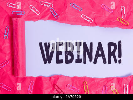 Handwriting text Webinar. Conceptual photo seminar or other presentation types that takes place on Internet Paper clip and torn cardboard placed above Stock Photo