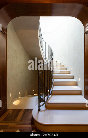 Luxury marble stairs with skylight and dark wood. No one inside Stock Photo