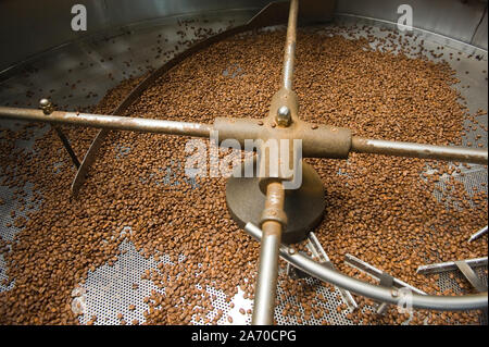 Coffee beans in a coffee roaster Stock Photo