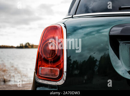 rear view of a rear view light on a Mini Countryman car at the beach