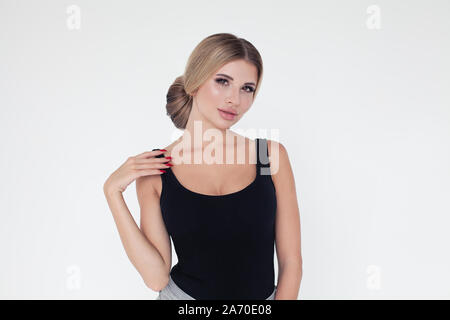 Pretty casual woman with blonde hair and red nails Stock Photo