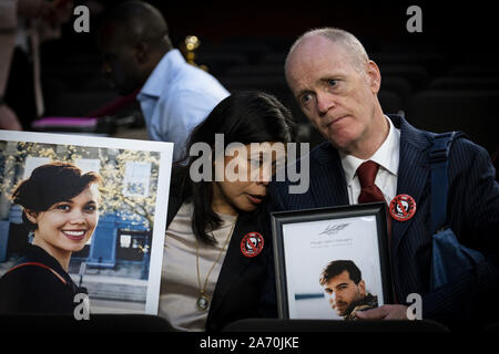 Washington, United States. 29th Oct, 2019. Family members hold photographs of loves ones killed in the Ethiopian Airlines Flight 302 and Lion Air Flight 610 crashes during the Senate Commerce, Science and Transportation Committee hearing on safety and the future of the Boeing 737 MAX on Capitol Hill on October 29, 2019 in Washington, DC. The hearing is being held on the anniversary of the Lion Air 737 Max crash that killed 189 people shortly after takeoff in from Jakarta, Indonesia. Photo by Pete Marovich/UPI Credit: UPI/Alamy Live News Stock Photo