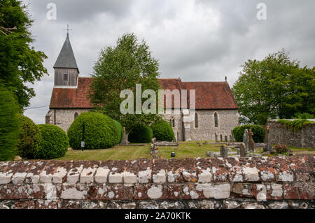 St Peter and St Paul church and graveyard in Exton village in Hampshire, England. Stock Photo