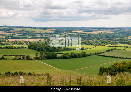 Far reaching views over the Hampshire countryside from South Downs Way near Beacon Hill National Nature Reserve east of Winchester, England. Stock Photo