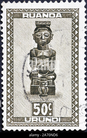 Wooden statue of Ruanda Urundi on postage stamp Stock Photo
