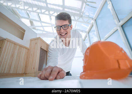 experienced architect doing calculations for new project Stock Photo