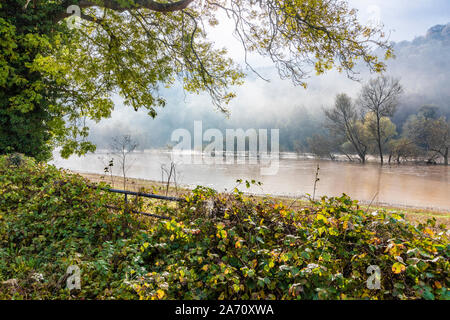 Mist rising over the River Wye in flood by the B4234 on 28.10.2019 near Kerne Bridge, Herefordshire UK - Flooding was caused by heavy rain in Wales. Stock Photo