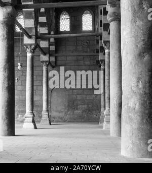 Black and white shot of corridor surrounding the courtyard of public historical Mosque of al Sultan al Nasir Muhammad Ibn Qalawun situated in the Citadel of Cairo, Egypt Stock Photo