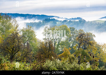 Morning autumn mist in the Wye Valley looking towards Lower Lydbrook, Gloucestershire UK Stock Photo
