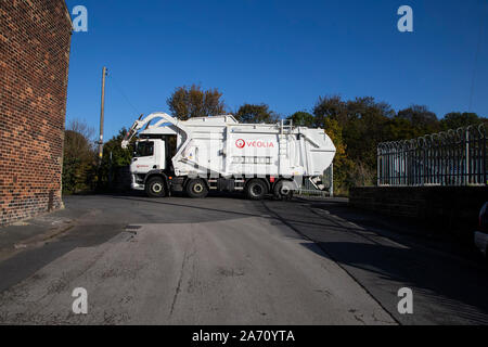 Veolia refuse lorry leaves an industrial estate in Mirfield, West Yorkshire U.K. Stock Photo