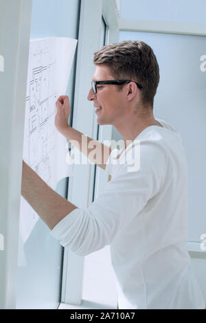 experienced architect reading blueprint of new project Stock Photo
