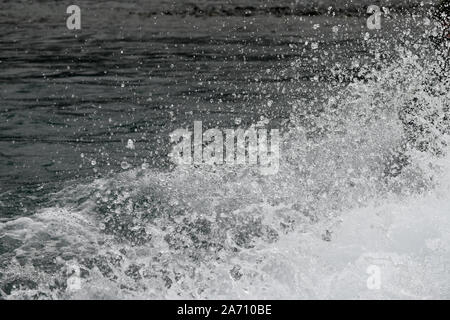 background of a spray of water and water droplets left in the wake of a jet boat Stock Photo