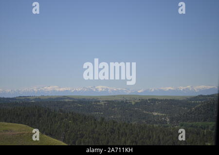 Late Spring in Montana: View of Snow-Capped Beartooth Mountains Along Highway Southwest of Billings Stock Photo