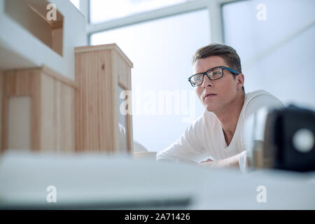 serious young designer pondering ideas for a new project Stock Photo