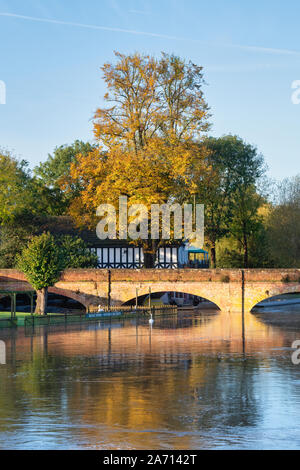 Tramway bridge across the flooded river avon on an autumn morning. Stratford Upon Avon, Warwickshire, England Stock Photo