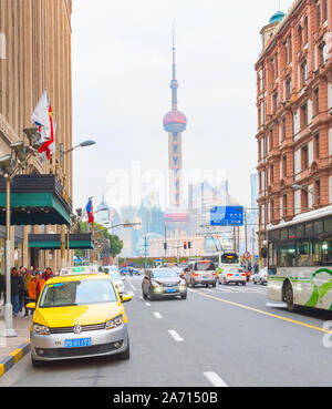 SHANGHAI, CHINA -DECEMBER 28, 2016: Traffic on the road in Downtown of Shanghai with view to TV Tower. Stock Photo