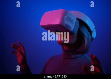 Young Woman Playing on Vr Glasses Touching Air Stock Photo