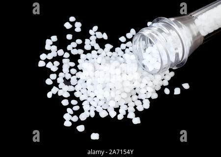 Close up picture of polypropylene (PP) granules isolated on black background, selective focus. Stock Photo