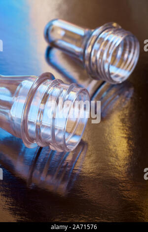 Close up picture of blow injection molding bottle preforms, selective focus. Stock Photo