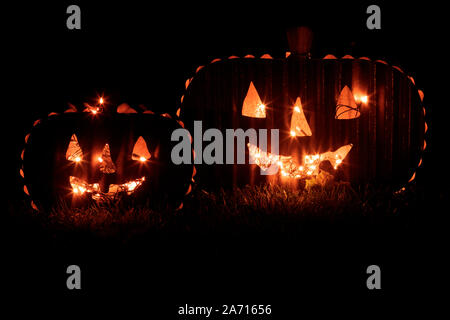 Two Jack O Lanterns Glowing in the Dark Stock Photo