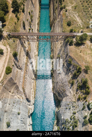 Aerial bird's eye view photo taken by drone of famous Corinth Canal with turquoise water, Peloponnese, Greece. The narrowest channel in the world and Stock Photo