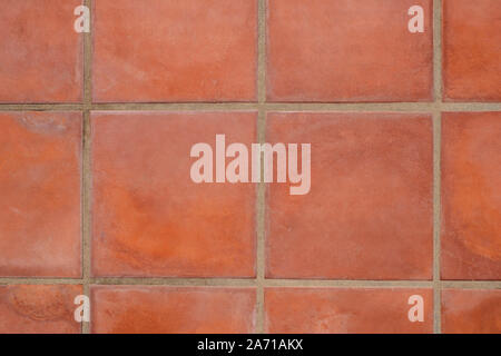 terracotta tiled floor background - terracotta tiles closeup Stock Photo