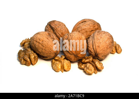 Walnuts in a shell and without it on a white background Stock Photo