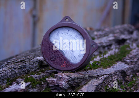 Close up of analog ammeter on the wood background Stock Photo