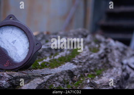 Close up of analog ammeter on the wood background Stock Photo