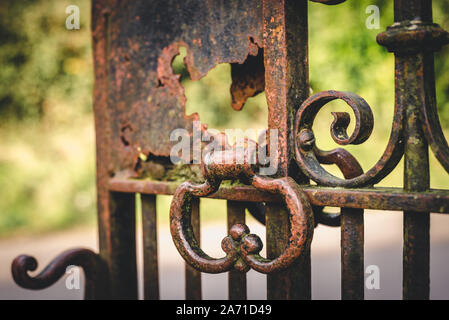 Rusty wrought iron gate and handle close up Stock Photo