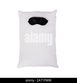 Personofied quilted pillow with sleeping mask isolated on white background. Soft cushion for comfortable sleep and sweet dreaming Stock Photo