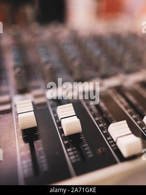 Shallow depth of field (selective focus) image with the controls on an audio mixer Stock Photo