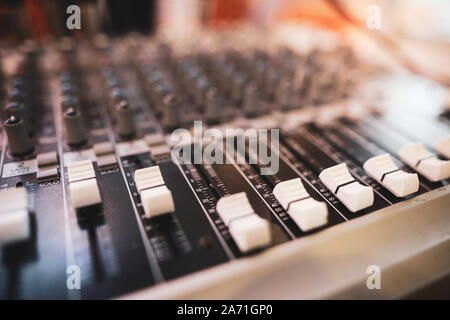 Shallow depth of field (selective focus) image with the controls on an audio mixer Stock Photo
