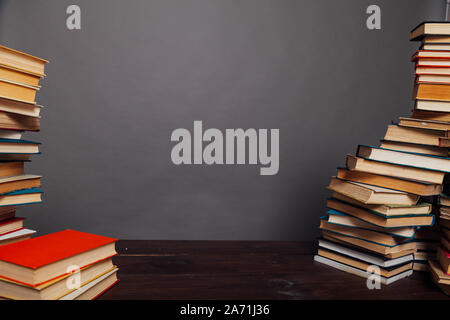 a lot of different educational books on a gray background Stock Photo