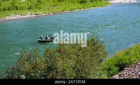 anglers fly fishing from a drift boat on the snake river Stock Photo