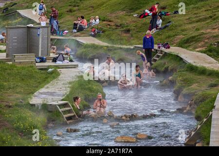 Bathing people in the hot thermal springs Reykjadalur, geothermal area, near Hveragerdi, southern Iceland, Iceland Stock Photo